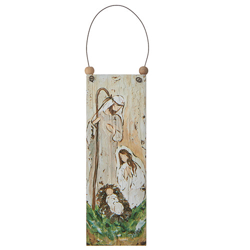A wooden ornament depicting the Holy Family, including Joseph, Mary, and baby Jesus, with a beige background and brown accents.