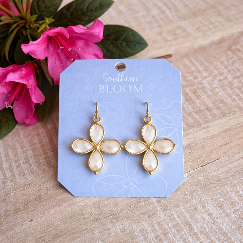 Floral earrings on a 'Southern Bloom' branded card with pink flowers in the background