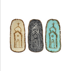 This unique Cast Iron Dish from Creative Co-op features a church building embossed in the center. Its distinct design is available in three different colors, and it has brown rims on all sides. The ideal size for serving hors d'oeuvres it can also be used as a decorative piece, and is 6"L x 2-3/4"W. Items are priced separately